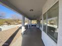 Spacious outdoor covered patio with scenic backyard and fountain views at 7636 E Coronado Rd, Mesa, AZ 85207