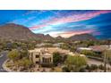 Exterior view with a colorful sky backdrop showcases the desert landscaping and views at 10040 E Happy Valley Rd # 269, Scottsdale, AZ 85255