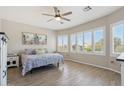 Spacious bedroom filled with natural light, featuring tile floors and large windows at 10134 E Meandering Trail Ln, Gold Canyon, AZ 85118