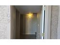 Bright foyer with light walls, a decorative light fixture, and a glimpse of the home's interior at 16616 E Palisades Blvd # 109, Fountain Hills, AZ 85268