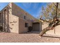 Tan stucco Sonora Villas building featuring desert landscaping at 16616 E Palisades Blvd # 109, Fountain Hills, AZ 85268