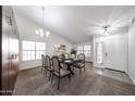 Bright dining room featuring a table set for six, and large built-in cabinets for ample storage space at 19622 N 66Th Ln, Glendale, AZ 85308