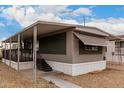 Exterior view of a single-story home with a covered porch and well-maintained yard at 2650 W Union Hills Dr # 350, Phoenix, AZ 85027