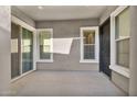 Enclosed patio featuring natural light, neutral colors, and multiple entry points at 2854 E Cashman Dr, Phoenix, AZ 85050