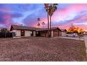 Charming single story home featuring a large front yard and an attached garage at 3037 W Libby St, Phoenix, AZ 85053
