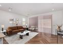 Bright living room with modern furnishings, stylish decor, and ample natural light at 33395 N 132Nd Dr, Peoria, AZ 85383