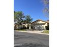 Charming single-story home with a well-manicured front lawn and inviting curb appeal at 50 W Calle De Arcos --, Tempe, AZ 85284