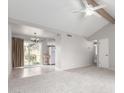 Bright and airy living room features vaulted ceilings and neutral color palette at 6514 S Lakeshore Dr # C, Tempe, AZ 85283