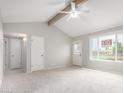 Bright and airy living room features vaulted ceilings and neutral color palette at 6514 S Lakeshore Dr # C, Tempe, AZ 85283