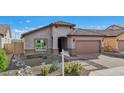 Charming single-story home featuring desert landscaping, tile roof, and paved driveway at 10841 W Nosean Rd, Peoria, AZ 85383