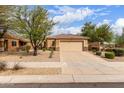 Charming single-story home features a desert landscape and a two-car garage at 12787 S 175Th Ave, Goodyear, AZ 85338