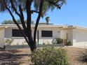 Attractive single-story home featuring white brick, tidy landscaping and an attached two car garage at 12807 N 21St Dr, Phoenix, AZ 85029