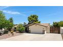 Street view of property featuring desert landscaping and a gated entrance on the right at 12809 N 50Th St, Scottsdale, AZ 85254