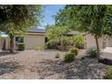 This home features desert landscaping and a two car garage at 12809 N 50Th St, Scottsdale, AZ 85254