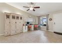 Bright home office with a built-in desk, storage, and natural light at 12809 N 50Th St, Scottsdale, AZ 85254