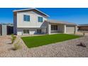 Beautifully landscaped front yard, with fresh grass and stone, complements this two-story home at 1658 W Pampa Ave, Mesa, AZ 85202