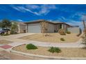 Charming single-story home with desert landscaping, two car garage and covered entry at 17308 W Daley Ln, Surprise, AZ 85387