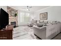 Inviting living room featuring a brick fireplace and comfortable seating area at 19777 N 76Th St # 1219, Scottsdale, AZ 85255