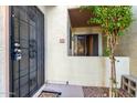 Private condo entrance features a secure metal door, block wall, and convenient access at 19820 N 13Th Ave # 169, Phoenix, AZ 85027