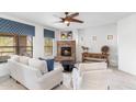 Bright living room showcasing a stone fireplace, comfortable seating, and stylish decor for a relaxing atmosphere at 21320 N 56Th St # 2005, Phoenix, AZ 85054