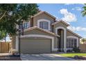 Charming two-story home with a well-manicured lawn and inviting curb appeal at 2640 S Terripin Cir, Mesa, AZ 85209