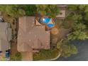 Aerial view of a home with a pool, sunshades, fire pit, and sand box at 2876 E Cherrywood Pl, Chandler, AZ 85249