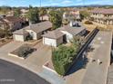 Aerial view of home showcasing desert landscaping, long driveway, well-maintained exterior, and neighborhood at 3036 E Bluefield Ave, Phoenix, AZ 85032