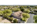 Expansive property featuring lush landscaping, a three car garage and an inviting pool area at 3950 E Mclellan Rd # 5, Mesa, AZ 85205