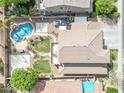 Aerial view of a property with a refreshing pool, lush yard, and ample space at 41213 N Linden St, Queen Creek, AZ 85140