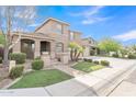 Charming two-story home featuring a spacious three-car garage and beautiful landscaping at 41213 N Linden St, Queen Creek, AZ 85140