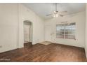 Bright living room with hard wood flooring, ceiling fan and natural light at 4622 E Fairbrook Cir, Mesa, AZ 85205