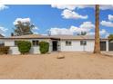 Charming single-story home featuring a low-maintenance landscape and attached garage at 5716 W Hazelwood St, Phoenix, AZ 85031