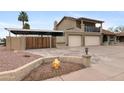 Charming two-story home with a two-car garage and fenced parking with landscaped front yard at 6240 W Cortez St, Glendale, AZ 85304