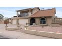 Charming two-story home featuring a two-car garage, balcony, and landscaped front yard at 6240 W Cortez St, Glendale, AZ 85304