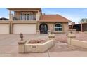 Charming two-story home featuring a two-car garage, balcony, and landscaped front yard at 6240 W Cortez St, Glendale, AZ 85304