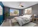 Serene bedroom with a large window, soft lighting, and a cozy bed at 9932 E Tumbleweed Ave, Mesa, AZ 85212