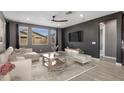 Comfortable living room featuring a sofa, TV, and neutral accents at 9932 E Tumbleweed Ave, Mesa, AZ 85212