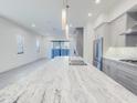 Kitchen featuring stainless appliances, stone countertops, and sleek cabinetry at 1 Easy St # 11, Carefree, AZ 85377