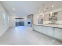 Open-concept living area featuring a fireplace and gourmet kitchen at 1 Easy St # 11, Carefree, AZ 85377