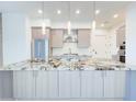 Close-up of kitchen with granite countertops, stainless steel appliances and wooden cabinets at 1 Easy St # 3, Carefree, AZ 85377