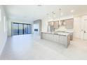 Bright, open-concept kitchen featuring granite countertops, stainless steel appliances, and access to the outdoor patio at 1 Easy St # 3, Carefree, AZ 85377