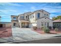 Elegant two-story home featuring a tile roof, spacious driveway, and desert landscaping at 15033 W Statler St, Surprise, AZ 85374