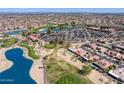 Community aerial shot with golf course, blue lake, and the Sonoran Plaza at 16100 W Galleria Ln, Surprise, AZ 85374