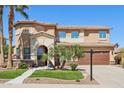 Inviting two-story home featuring mature landscaping, a well-maintained lawn, and a convenient two-car garage at 18504 W Maui Ln, Surprise, AZ 85388