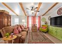 Comfortable living room featuring wood beam ceiling and stylish furnishings at 201 S Greenfield Rd # 65, Mesa, AZ 85206