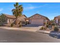 Charming single-story home with desert landscaping and a two-car garage in a sunny neighborhood at 21655 N Davis Way, Maricopa, AZ 85138