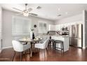 Open kitchen and dining area featuring granite countertops, stainless steel appliances, and a cozy breakfast nook at 220 W Wood Dr, Chandler, AZ 85248