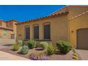 Charming single-story home with a terracotta roof, desert landscaping, and well-maintained curb appeal at 23133 N 73Rd Pl, Scottsdale, AZ 85255