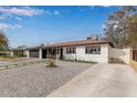 Bright and charming single-story home featuring front yard with stylish gravel and a spacious driveway at 2502 W Freeway Ln, Phoenix, AZ 85021