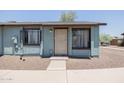 Charming single-story townhouse featuring a secure front door and xeriscaped front yard at 3646 N 67Th Ave # 12, Phoenix, AZ 85033